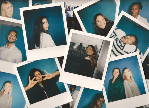 A collage of polaroid picture of Hogan Lovells people.